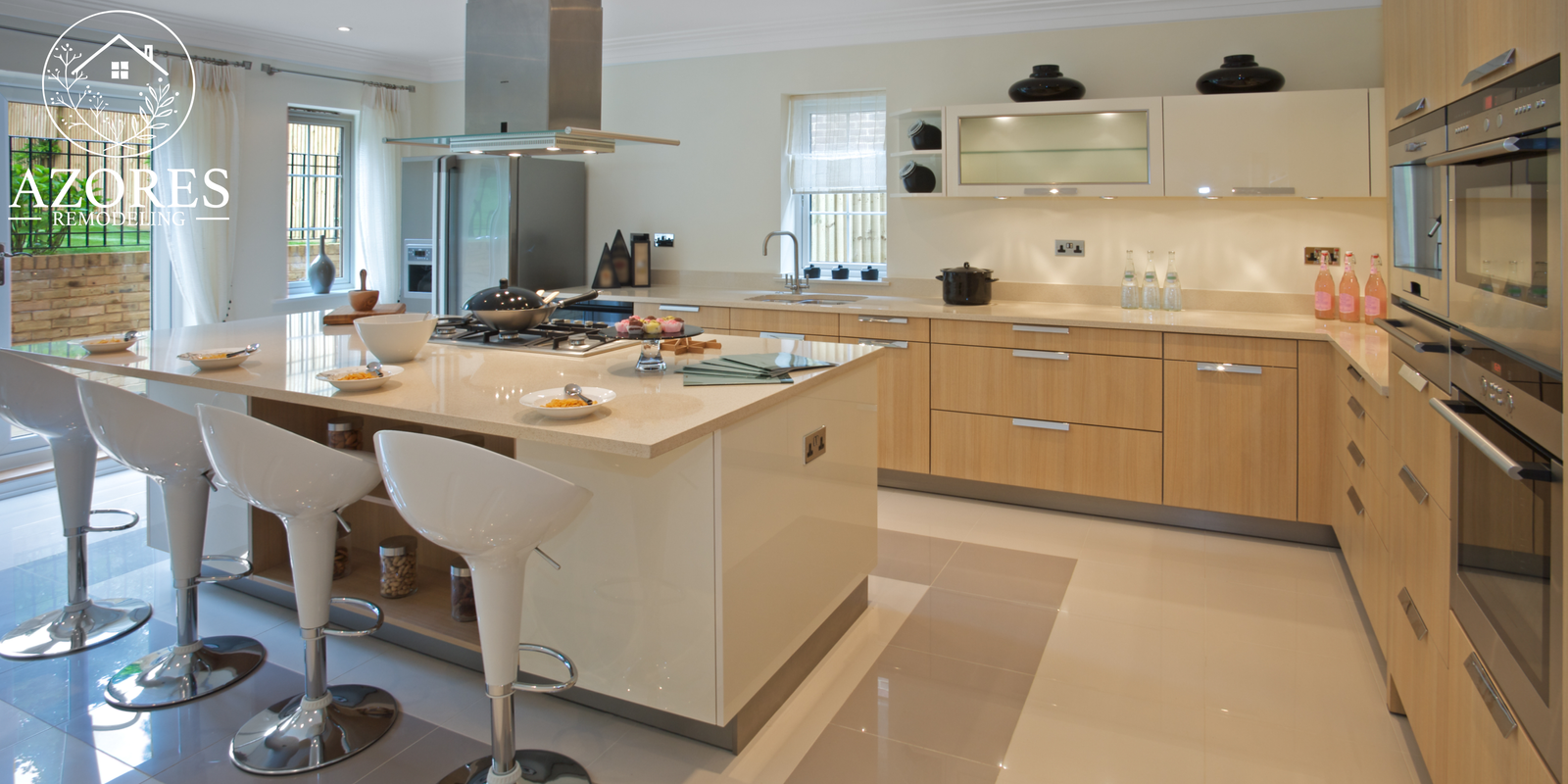 Luxury modern kitchen with marble waterfall island and gold pendant lighting in DFW home